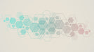 Geometric wallpaper pattern featuring interconnected hexagonal outlines in seafoam green and soft rose on a cream background.