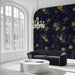 A cozy library wall featuring a dark Japanese cloud mural behind a mahogany desk.
