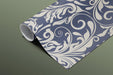 Classic scroll patterned wall mural installed behind a home office mahogany desk