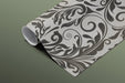 Sophisticated wallpaper with classic scrolling motifs in a formal home study