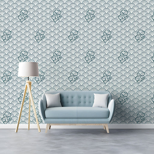 A minimalist living room featuring a wave pattern wallpaper on the feature wall.