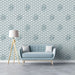 A minimalist living room featuring a wave pattern wallpaper on the feature wall.