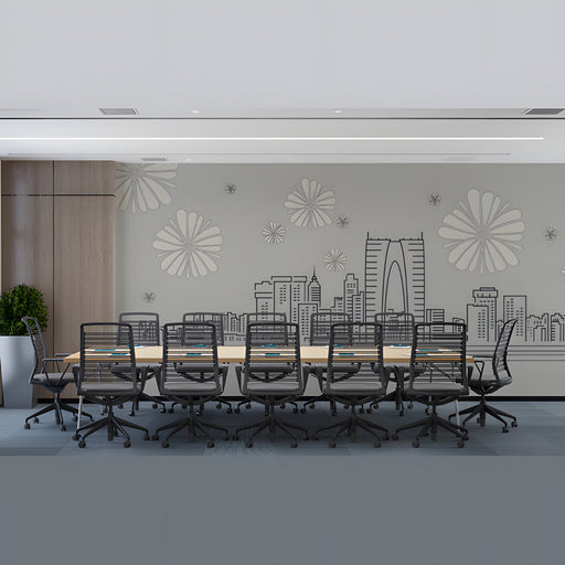 Modern office with a minimalist city skyline mural above a desk