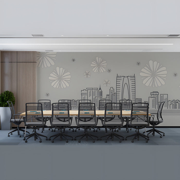 Modern office with a minimalist city skyline mural above a desk