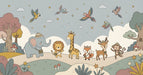 Whimsical safari animal mural with elephant, giraffe, and lion in soft sage, ochre, and dusty rose colors.