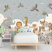 Kids bedroom wall mural with animal friends and stars for a calming bedtime atmosphere.