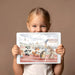 Playful animal racing mural as a feature wall in a sunny kids' playroom.