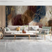 Sophisticated living room feature wall decorated with abstract burgundy and navy botanical wallpaper.