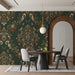 Cozy dining room featuring an ornate, nature-inspired damask wall mural in deep green
