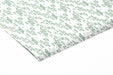 Serene minimalist bedroom featuring a light and airy green line pattern wallpaper behind the bed headboard