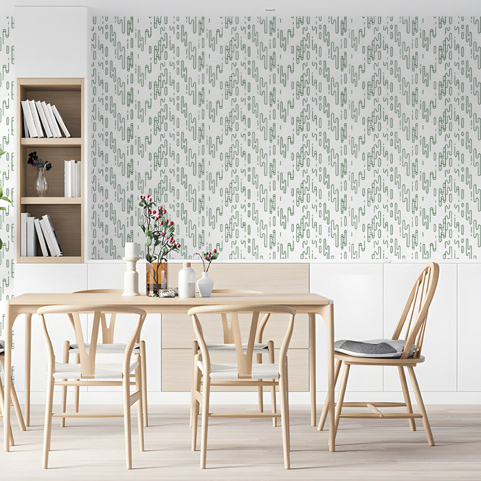 Modern dining room with sage green geometric line art wallpaper on the feature wall behind a wooden desk