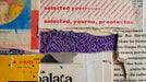 Abstract wallpaper design featuring torn paper layers, vintage typography, and vibrant yellow, purple, and blue color blocks.