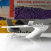 A creative home office featuring the collage wallpaper mural as an inspiring backdrop for a minimalist desk setup.