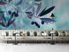 Modern bar featuring a serene olive branch mural behind a gray velvet sofa