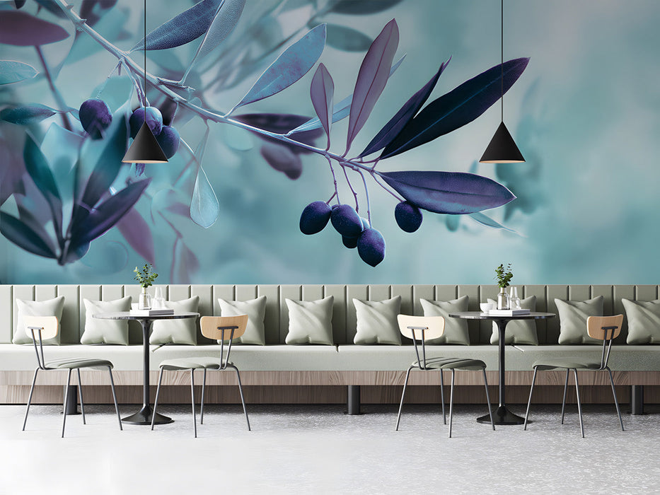 Modern bar featuring a serene olive branch mural behind a gray velvet sofa