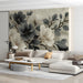 Monochrome floral wallpaper installed in a bright modern living room with minimalist furniture