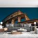 A quiet living room showcasing a classic Italian landscape mural on the main wall