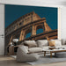 A sophisticated living room featuring the Colosseum mural behind a mahogany desk