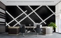 Modern office featuring a geometric white grid wallpaper on a feature wall behind a grey sofa.