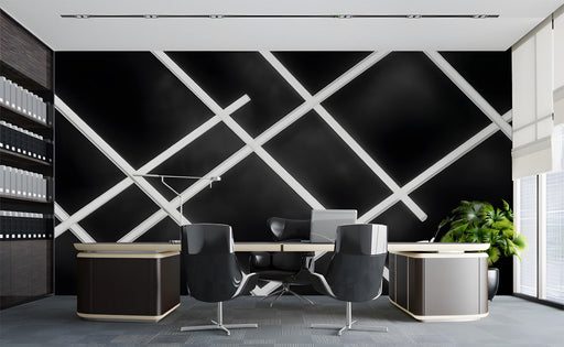 Modern office featuring a geometric white grid wallpaper on a feature wall behind a grey sofa.