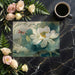 Water-inspired floral wallpaper in a bright, airy sunroom with white furniture