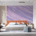 Abstract art mural in a bedroom with minimalist wooden furniture