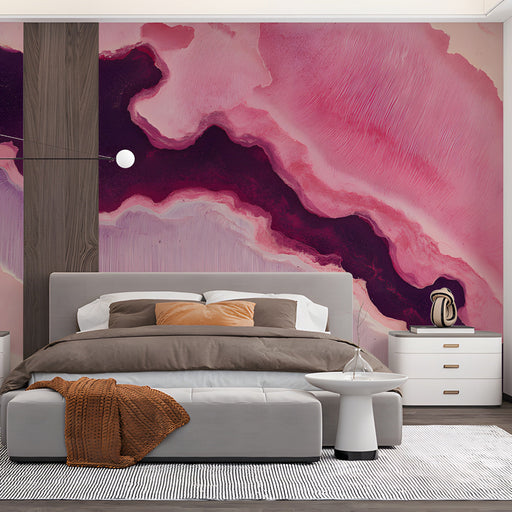 Stylish bedroom space with an expressive fluid art mural in shades of pink and deep purple