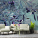 Minimalist living area with the blue and violet olive branch wallpaper as an accent wall.