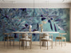 Meeting room featuring the olive branch mural behind a velvet sofa in soft neutral colors.