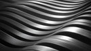 Abstract wallpaper featuring flowing charcoal and silver 3D waves with a metallic finish.
