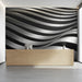 A minimalist reception featuring the sculptural wave pattern in dark shades on the headboard wall.