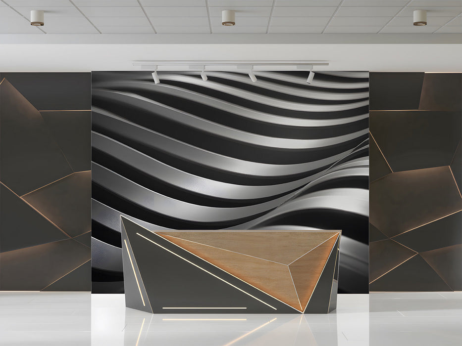 A sleek modern office wall featuring an abstract charcoal wave mural behind a glass desk.