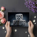 Moody home office wall with casino dice wallpaper and dark minimalist furniture