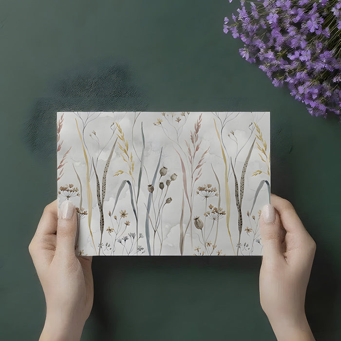 A minimalist home office space with a subtle dried flower wallpaper mural and natural wooden furniture.