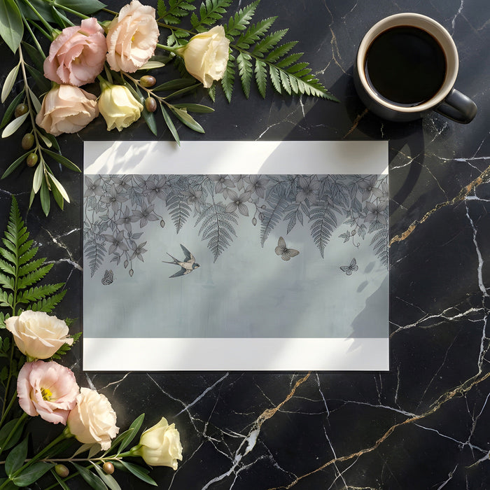 A cozy home office featuring the delicate swallow and floral nature mural on a feature wall