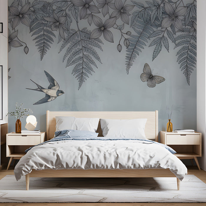 A calming bedroom with a soft blue floral and bird wallpaper accent wall