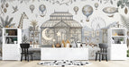 A sophisticated kid's room featuring the vintage botanical mural as a feature wall behind a wooden desk.