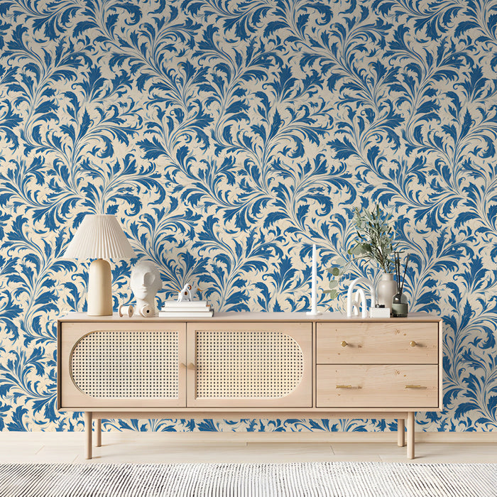 A  bedroom or library wall covered in classic blue trailing leaf mural wallpaper.