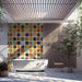 Playful bathroom interior decorated with a vibrant, painterly grid mural on the main wall
