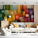 A modern living room featuring the colorful block mural behind a neutral cream sofa.