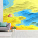 Contemporary hallway with a vibrant topographic mural behind a sofa