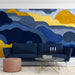 Modern study featuring a bold ochre and navy abstract mural