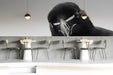 Minimalist bar with a large black and white bird mural behind the headboard