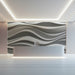 Sophisticated reception interior with flowing wave pattern wallpaper in soft gray
