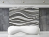 Modern entryway featuring a 3D gray wave wall mural behind a minimalist sofa
