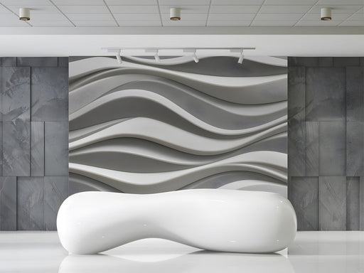 Modern entryway featuring a 3D gray wave wall mural behind a minimalist sofa