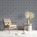 Close up of gray damask wallpaper installed in a modern minimalist study
