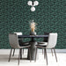 Elegant green and charcoal patterned wallpaper in a dining room