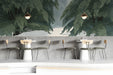 Moody bar with a forest landscape wall mural behind a wooden bed frame.