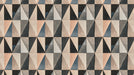 Abstract geometric mural wallpaper with triangles in charcoal, slate, and beige.